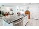 Modern kitchen featuring a center island, granite countertops, and stainless steel dishwasher at 7161 Sw 135Th Pl, Ocala, FL 34473