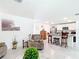 Open concept living area with kitchen view, featuring neutral colors and seating at 7161 Sw 135Th Pl, Ocala, FL 34473