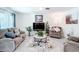 Comfortable living room with neutral tones, offering lots of seating and natural light at 7161 Sw 135Th Pl, Ocala, FL 34473