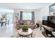 Inviting living room with comfortable sofa, decor, and plenty of natural light at 7161 Sw 135Th Pl, Ocala, FL 34473