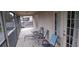 Spacious screened balcony with outdoor seating and tranquil views at 844 Suffolk Pl, Davenport, FL 33896