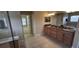 Spacious bathroom with tiled flooring, a granite dual sink vanity, a shower, and separate bathtub at 844 Suffolk Pl, Davenport, FL 33896
