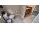 Bathroom featuring a toilet, tile flooring, and a glimpse of the vanity area for convenience at 844 Suffolk Pl, Davenport, FL 33896