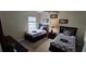 Neutral bedroom featuring two twin beds with nightstand and lamp at 844 Suffolk Pl, Davenport, FL 33896