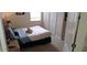 Cozy bedroom with neutral carpet, closet, and a comfortable queen-sized bed at 844 Suffolk Pl, Davenport, FL 33896