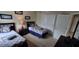 Bedroom features two twin beds, closet, and ensuite bathroom at 844 Suffolk Pl, Davenport, FL 33896