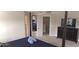 Spacious bedroom featuring a dark wood four-poster bed, and a dresser with a modern television at 844 Suffolk Pl, Davenport, FL 33896