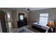 Bedroom showcasing two beds, a ceiling fan, and a dark dresser at 844 Suffolk Pl, Davenport, FL 33896