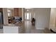 Bright kitchen with granite countertops, stainless steel appliances, and an open layout leading to the dining area at 844 Suffolk Pl, Davenport, FL 33896