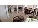 Spacious living room showcasing decorative columns, a dining table, and a comfortable seating area at 844 Suffolk Pl, Davenport, FL 33896