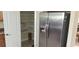 Pantry and stainless steel refrigerator showcasing ample storage space at 844 Suffolk Pl, Davenport, FL 33896