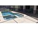 Inviting pool and jacuzzi featuring clear blue water, accessible shallow areas, and a protective safety fence at 844 Suffolk Pl, Davenport, FL 33896
