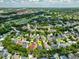 An aerial view of the neighborhood, highlighting the property's location among lush greenery and community amenities at 922 Jasmine St, Celebration, FL 34747