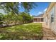 Well-maintained backyard with lush greenery, a paver patio, and privacy fencing at 922 Jasmine St, Celebration, FL 34747