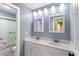 Bathroom featuring double vanity, great lighting, and a tub at 922 Jasmine St, Celebration, FL 34747