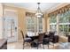 Cozy dining area featuring a built-in bench, modern chandelier, and ample natural light at 922 Jasmine St, Celebration, FL 34747