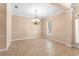 Dining room with chair rail, decorative chandelier, and natural light from a window at 922 Jasmine St, Celebration, FL 34747