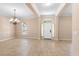 Open foyer with tile flooring, natural light, and a chandelier at 922 Jasmine St, Celebration, FL 34747