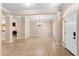 Open foyer with tile flooring, natural light, and a white front door at 922 Jasmine St, Celebration, FL 34747