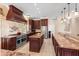 Spacious kitchen with custom cabinetry, a large island, stainless steel appliances, and a tile floor at 922 Jasmine St, Celebration, FL 34747