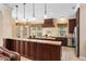 Gourmet kitchen with cherry cabinets, granite counters, and stainless steel appliances at 922 Jasmine St, Celebration, FL 34747