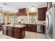Gourmet kitchen features custom cabinets, a large island, and stainless steel appliances at 922 Jasmine St, Celebration, FL 34747