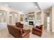 Cozy living room featuring a fireplace, built-in shelving, and comfortable leather seating at 922 Jasmine St, Celebration, FL 34747