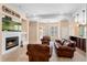 Cozy living room with fireplace, comfortable seating, and ample natural light at 922 Jasmine St, Celebration, FL 34747