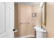 Small powder room with a sink and mirror at 922 Jasmine St, Celebration, FL 34747