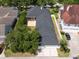 Aerial view of the home showcasing the roof, screened patio, and well-maintained landscaping at 922 Jasmine St, Celebration, FL 34747