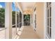 Relaxing screened porch with ceiling fans, offering a serene outdoor space at 922 Jasmine St, Celebration, FL 34747