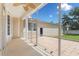 Screened-in porch with a view of the back yard, perfect for outdoor lounging at 922 Jasmine St, Celebration, FL 34747