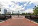 Lake Eola view with brick paved path, benches, and cityscape background on a partly cloudy day at 10 N Summerlin Ave # 14, Orlando, FL 32801