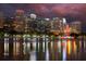 Lake Eola with cityscape and fountain illuminated at night, water reflections create a beautiful scene at 10 N Summerlin Ave # 14, Orlando, FL 32801