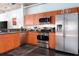 Modern kitchen with stainless steel appliances, stylish cabinets, and dark countertops at 10 N Summerlin Ave # 14, Orlando, FL 32801