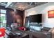 Comfortable living room with modern furniture, an industrial ceiling, and stylish decor, bathed in natural light at 10 N Summerlin Ave # 14, Orlando, FL 32801