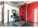 Sleek office space with modern desk, shelving, and stylish decor, featuring a vibrant accent wall and ample light at 10 N Summerlin Ave # 14, Orlando, FL 32801