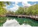 Picturesque view of bridge, trees, and pond in Lake Eola Park at 10 N Summerlin Ave # 14, Orlando, FL 32801