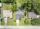 Aerial view of property showing layout with pool, neighboring houses, and street access at 1181 Pine Ln, St Cloud, FL 34771