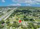 Expansive aerial view of a residential neighborhood, showcasing lush greenery and community at 1181 Pine Ln, St Cloud, FL 34771