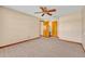 The bedroom showcases two closets, neutral walls, and tile floors, offering a practical and clean space at 1181 Pine Ln, St Cloud, FL 34771