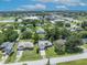 Beautiful aerial of residential home with lush green lawns, and a well manicured yard at 1181 Pine Ln, St Cloud, FL 34771