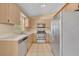 A functional kitchen with stainless steel appliances and a window providing natural light at 1181 Pine Ln, St Cloud, FL 34771