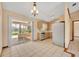 Kitchen featuring stainless steel appliances and a view of the screened patio and pool at 1181 Pine Ln, St Cloud, FL 34771