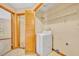Convenient laundry room with washer and storage at 1181 Pine Ln, St Cloud, FL 34771
