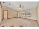 Open living area featuring tile floors, natural light, and a welcoming front entrance at 1181 Pine Ln, St Cloud, FL 34771