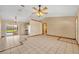 Open-concept kitchen and living area with sliding doors leading to the pool area at 1181 Pine Ln, St Cloud, FL 34771