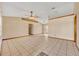 Bright living room with neutral tones, tile flooring, and elegant trim at 1181 Pine Ln, St Cloud, FL 34771