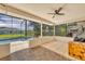 Enjoy a relaxing screened lanai with tiled floors and fan overlooking the pool at 1181 Pine Ln, St Cloud, FL 34771