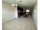 View of the kitchen and dining space with tile flooring and ample natural light at 12359 Langstaff Dr, Windermere, FL 34786